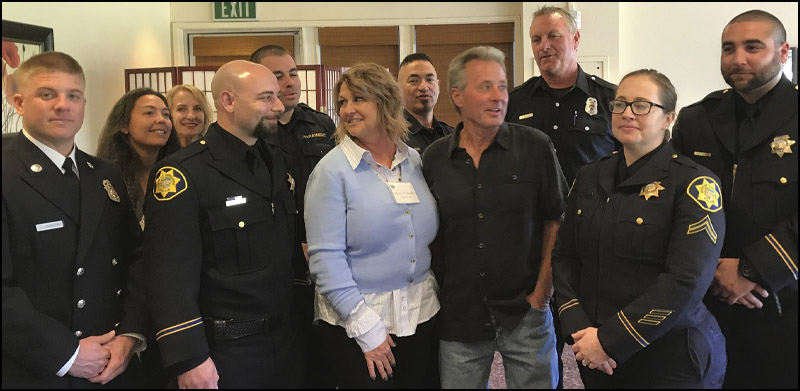 Concord resident Kevin O'Conner with wife Donna, surrounded first responders who rescued him during a July medical emergency from the Concord Police Department, Contra Costa County Fire Protection District and American Medical Response.