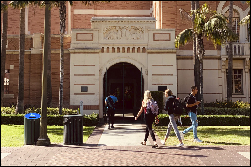 Students walking on college campus.